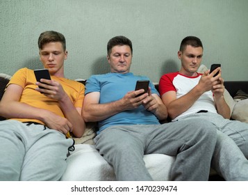 Anti Social Family Using Smartphones On Sofa 