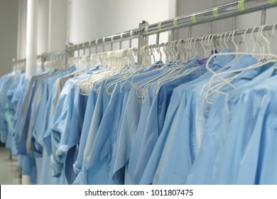 Anti Static Workwear Or  ESD Smock Shirts Are Hanging In Cleanroom. 