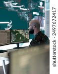 Anti terrorism division controlling air and sea traffic activity around the national territory, ensuring protection from military base of operations. Army engineer operates radar surveillance.