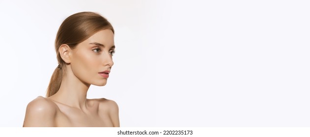 Anti-aging Facial Treatment. Closeup Portrait Of Beautiful Young Girl With Clean Well-kept Skin Isolated Over White Background. Skin Care. Cosmetology, Youth, Beauty And Spa. Flyer For Ad