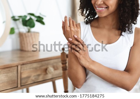 Image, Stock Photo Unrecognizable black woman touching wet ground with hand