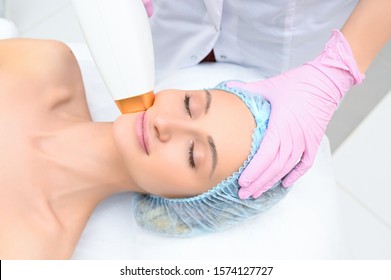 Anti-aging Procedures. Skin Care Concept. Woman Receiving Facial Beauty Treatment, Removing Pigmentation At Cosmetic Clinic. Intense Pulsed Light Therapy. IPL. Rejuvenation, Photo Facial Therapy.