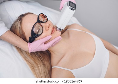 Anti-aging Procedures. Skin Care Concept. Woman Receiving Facial Beauty Treatment, Removing Pigmentation At Cosmetic Clinic. Intense Pulsed Light Therapy. IPL. Rejuvenation, Photo Facial Therapy.