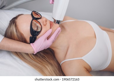 Anti-aging Procedures. Skin Care Concept. Woman Receiving Facial Beauty Treatment, Removing Pigmentation At Cosmetic Clinic. Intense Pulsed Light Therapy. IPL. Rejuvenation, Photo Facial Therapy.