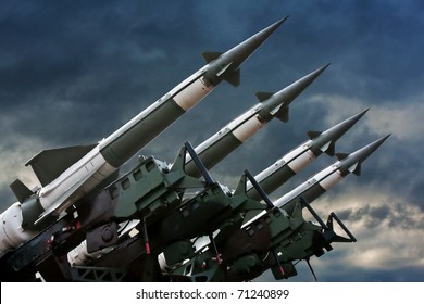 Antiaircraft  rockets on the launcher against dramatic sky.