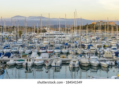 Antibes Harbour With Yachts And Fort In The Background