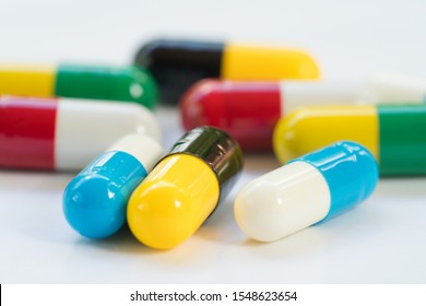 Antibiotic capsules pills on white background. Drug resistance concept. Antibiotics drug use with reasonable. Antibiotic Resistant.