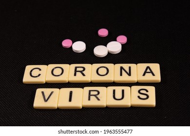 Antibiotic Pills On Black Background. Healthcare And Medicine Concept. Coronavirus Inscription