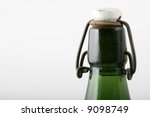 antic top of a green bottle with cap