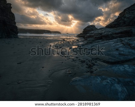 Anticlinal rays pierce the sunset clouds off Illas beach in Ribadeo Lugo Galicia