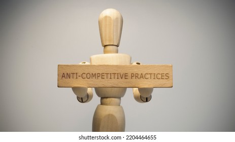 Anti-competitive Practices Written On Wooden Surface. Close-up In The Studio. Social Issues