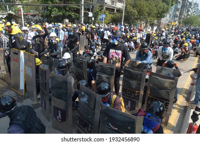 Anti-coup Protesters Stand Behind A Makeshift Shield During Against The Military Coup In Yangon, Myanmar On 09 March 2021.