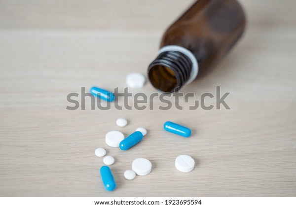 Antidepressant\
drugs meds, capsule and pills on\
table