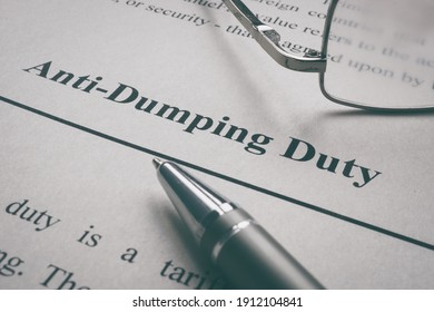 Anti-Dumping Duty words on the page and glasses.