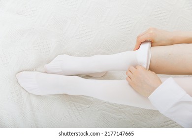 Anti-embolic Compression Hosiery For Surgery Isolated On White. Medical White Stockings, Tights For Varicose Veins And Venouse Therapy. Thrombo Embolic Deterrent Hose Or Anti-embolism Stockings.