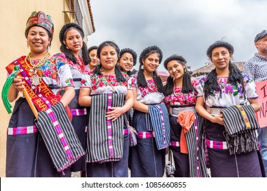 Antigua, Guatemala - January 21, 2017: Maya beauty pageant princesses from Quiche dressed in traditional costume in the street of UNESCO World Heritage Site