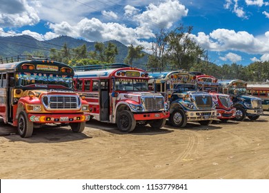 Antigua Guatemala, Guatemala - July 02, 2016:  Colorful chicken buses in the street and market of Antigua Guatemala.