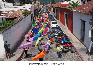 Antigua, Sacatepéquez / Guatemala - September 7 2019: Independence Day Parade, School Children Marching Band In Town Centre With Drums, Brass And Bright Coloured Flags.