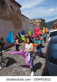 Antigua, Sacatepéquez / Guatemala - September 7 2019: Independence Day Parade, School Children Marching Band In Town Centre With Drums, Brass And Bright Coloured Flags.