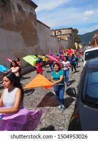 Antigua, Sacatepéquez / Guatemala - September 7 2019: Independence Day Parade, School Children Marching Band In Town Centre With Drums, Brass And Bright Coloured Flags.