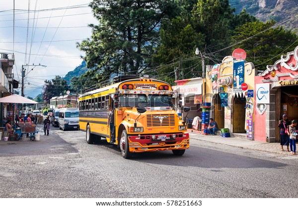 ANTIGUA,GUATEMALA -DEC 24, 2015:Typical\
guatemalan chicken bus in the steet of Antigua on Dec 24,\
2015,Guatemala.Chicken bus It\'s a name for colorful, decorated bus\
in various latin American\
countries