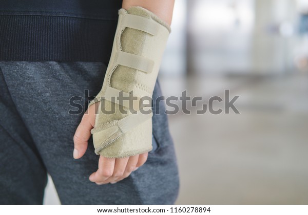 Anti-Injury\
Equipment, suitable for people with wrist pain from inflammation of\
wrist ligaments with copy space for\
text