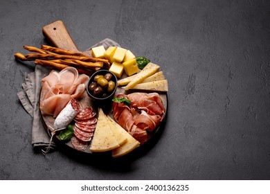 Antipasto board with various meat and cheese snacks. Wth copy space - Powered by Shutterstock