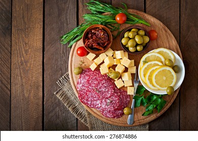 Antipasto Catering Platter With Salami And Cheese On A Wooden Background