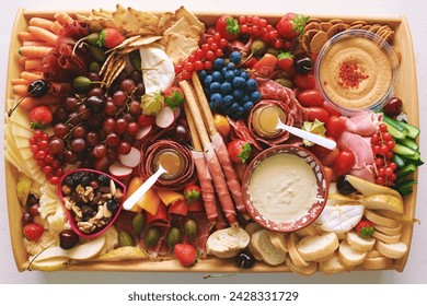 Antipasto platter with meat, chease, fruits, vegetables and nuts. Appetizer, catering food concept - Powered by Shutterstock