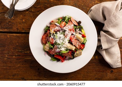 Antipasto Salad With Salami, Artichoke Hearts, Fresh Vegetables And Parmesan