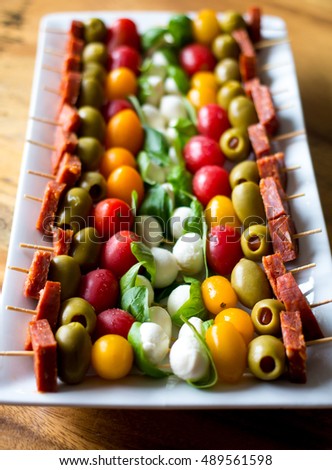 Similar – Image, Stock Photo Tomato mozzarella skewers with basil