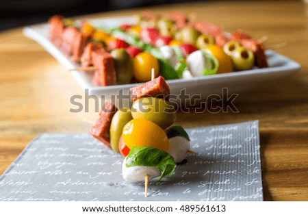 Similar – Image, Stock Photo Tomato mozzarella skewers with basil