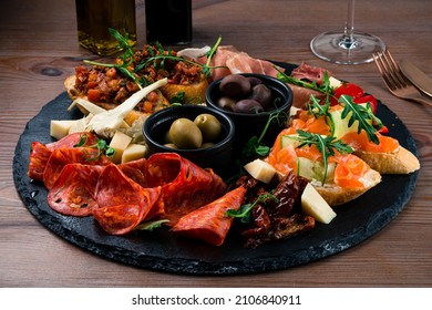 Antipasto Tray With Prosciutto, Salami, Cheese, Olives, Artichokes And Bruschetta. Antipasto Board