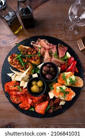 Antipasto Tray With Prosciutto, Salami, Cheese, Olives, Artichokes And Bruschetta. Antipasto Board