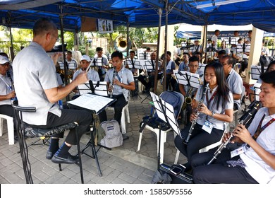 Antipolo City, Philippines – December 10, 2019: Marching Band Practice Songs With Their Conductor Before A Performance.