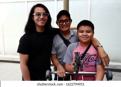 Antipolo City, Philippines - January 14, 2020: Portrait Of A Filipino Senior Man, Teenager And Child.