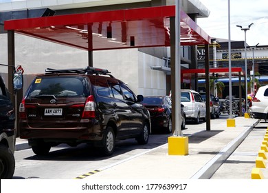 Antipolo City, Philippines - July 17, 2020: Customers In Their Cars Line Up At The Drive Thru Facility Of A Fast Food Restaurant.