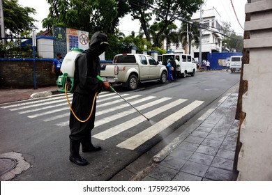 Antipolo City, Philippines - June 15, 2020: Health Worker Spray Disinfectant Around A Public Park During The Covid 19 Virus Outbreak.