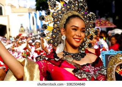 ANTIPOLO CITY, PHILIPPINES - MAY 1, 2018: Parade participants in their colorful costumes march and dance in the street during the Sumakah Festival in Antipolo City. - Shutterstock ID 1082504840
