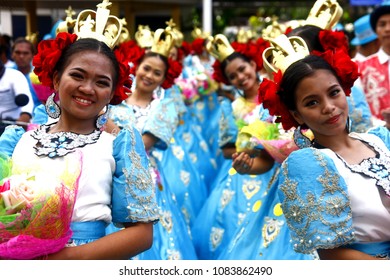 ANTIPOLO CITY, PHILIPPINES - MAY 1, 2018: Parade participants in their colorful costumes march and dance in the street during the Sumakah Festival in Antipolo City. - Shutterstock ID 1083862490
