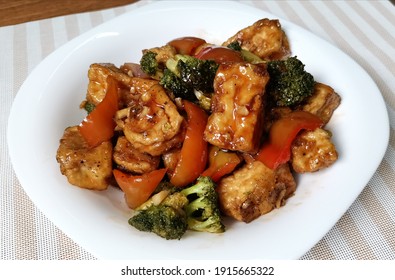 Antipolo, Philippines - July 2020: A Yummy Sweet And Sour Broccoli Tofu Tastes Like Chicken Served On A  White Plate.