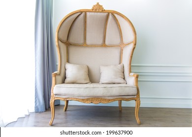 Antique Armchair In White Room With Curtain Background