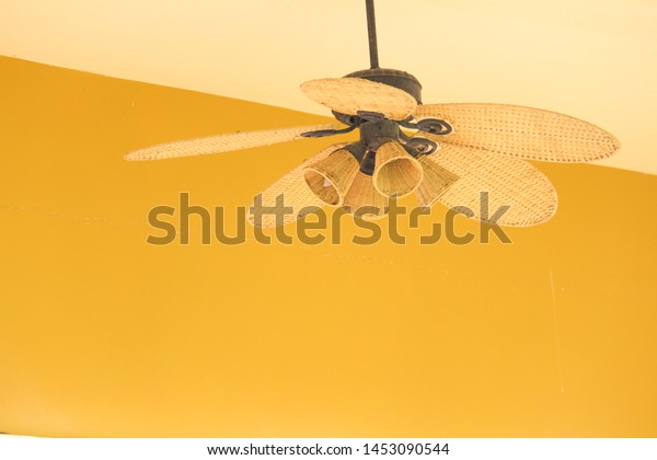 Antique Bamboo Ceiling Fan Yellow Background Stock Photo