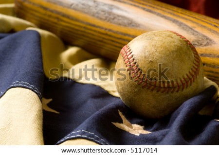 Antique baseball and bat on vintage american flag inspired bunting