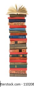 Antique Book Stack With Open Book On The Top Isolated On White Background