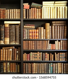 antique books on bookshelf in a library - Shutterstock ID 1568594755