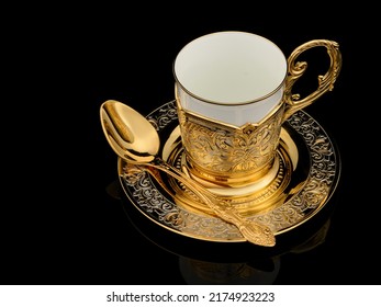 Antique Brass Luxury Gold Tea Party Kit Set Isolated On Black Background With Reflection. Souvenir Gift With Traditional Engraving And Carving Patterns.