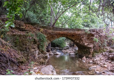 An Antique Bridge Above Amud Stream In The Nature Reserve Wadi Amud. The Murmur Of Water And Silence In The Early Morning In The Natural Reserve.