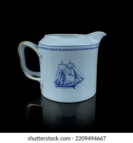 Antique British Blue Porcelain Tea Set With Ship Motifs.
Antique Milk Jug With Ship Drawing Service Closeup