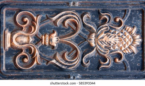 antique bronze bas-relief of the metal as a background